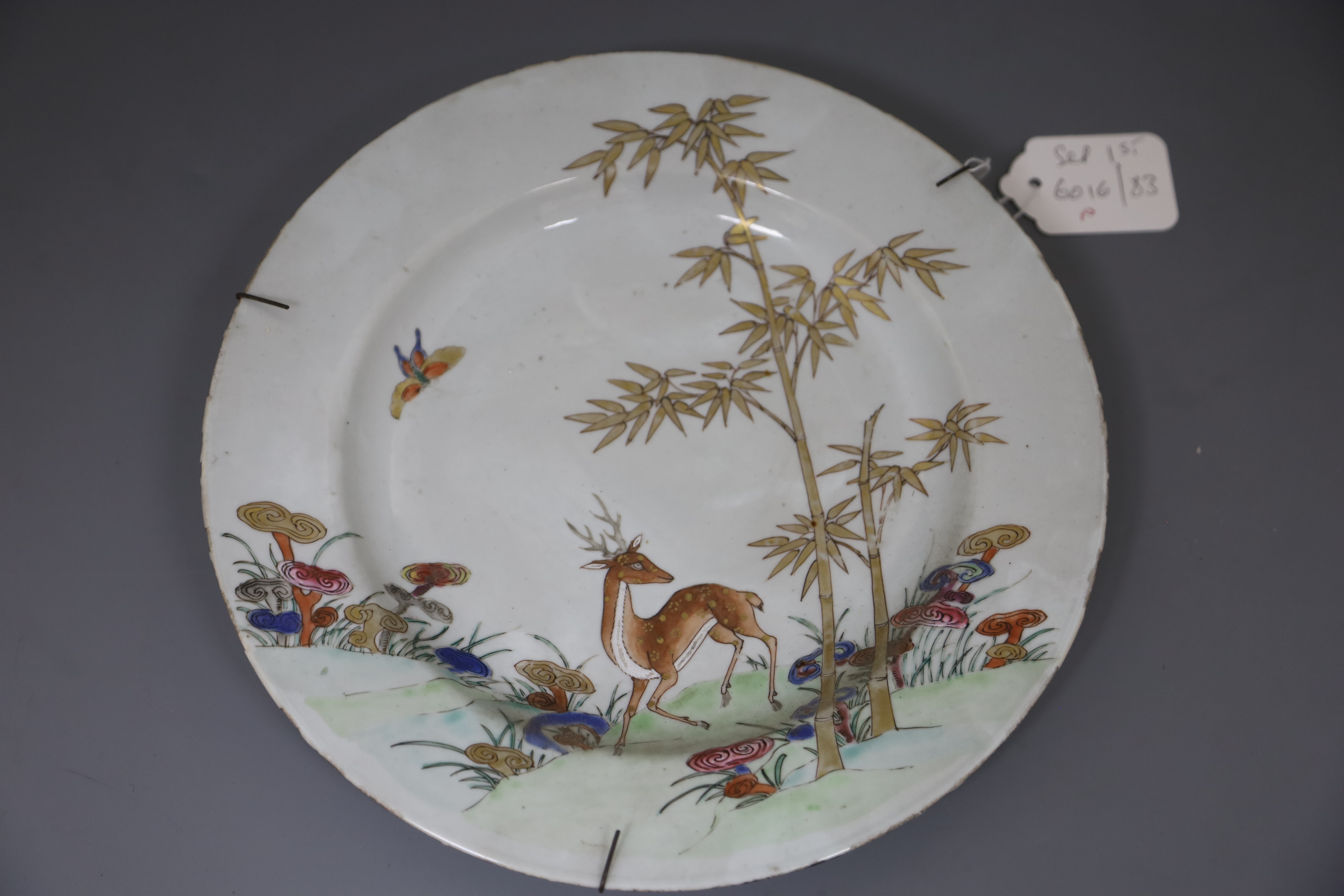 Three graduated Chinese famille rose deer, bamboo and lingzhi dishes, Qianlong period (1736-95), D. 26cm, 32cm and 38.5cm